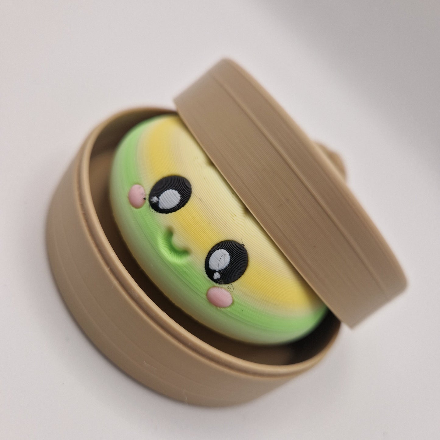 3D printed large dumpling clickers in basket.