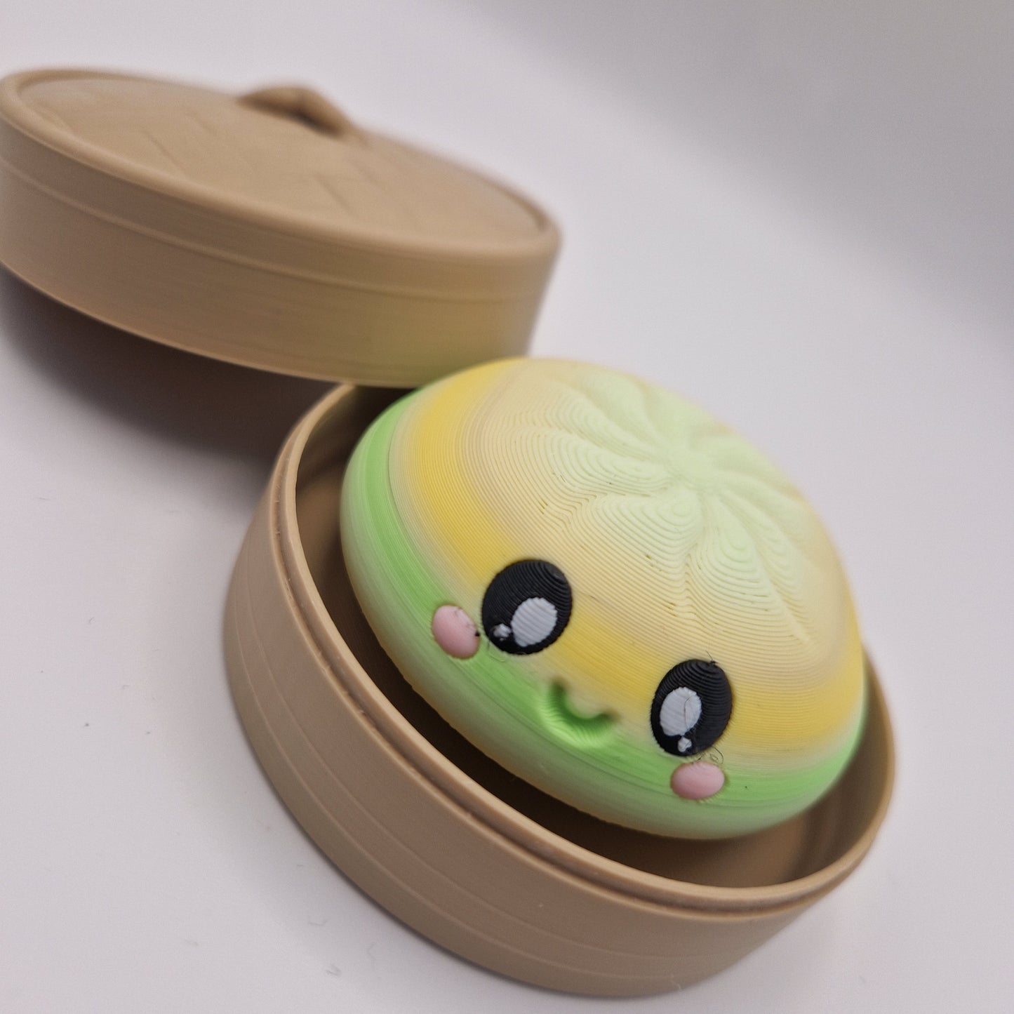3D printed large dumpling clickers in basket.