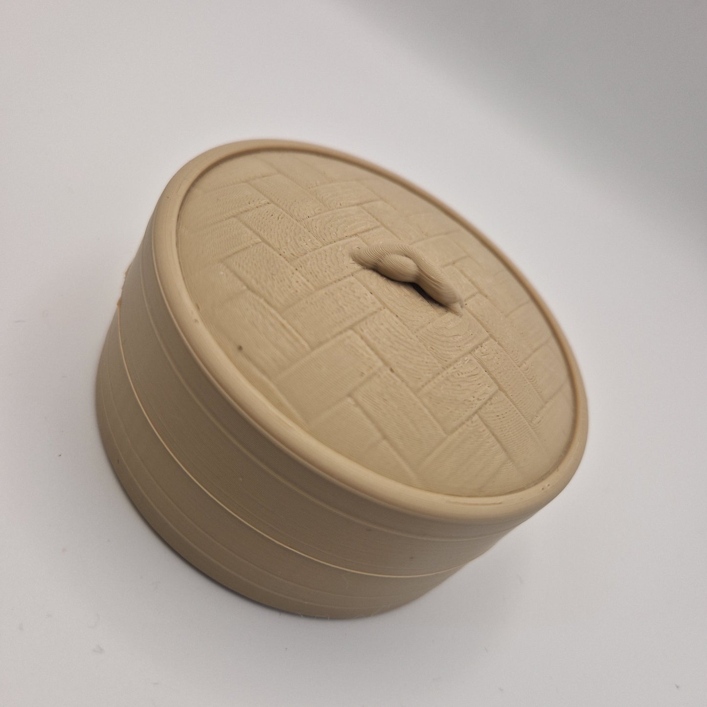 3D printed large dumpling clickers in basket.