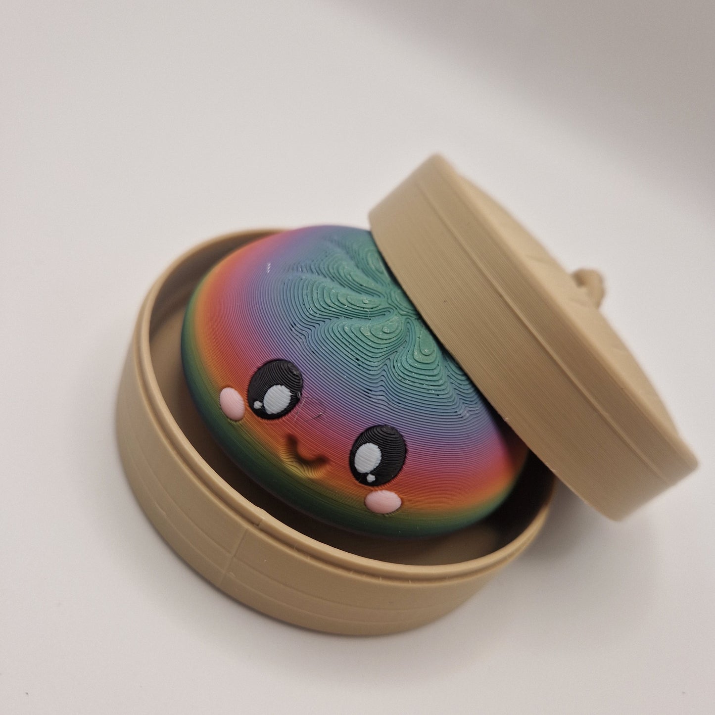3d printed Dumpling clickers in steamer basket