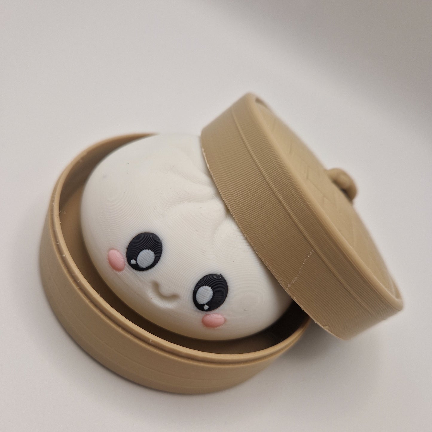 3d printed Dumpling clickers in steamer basket