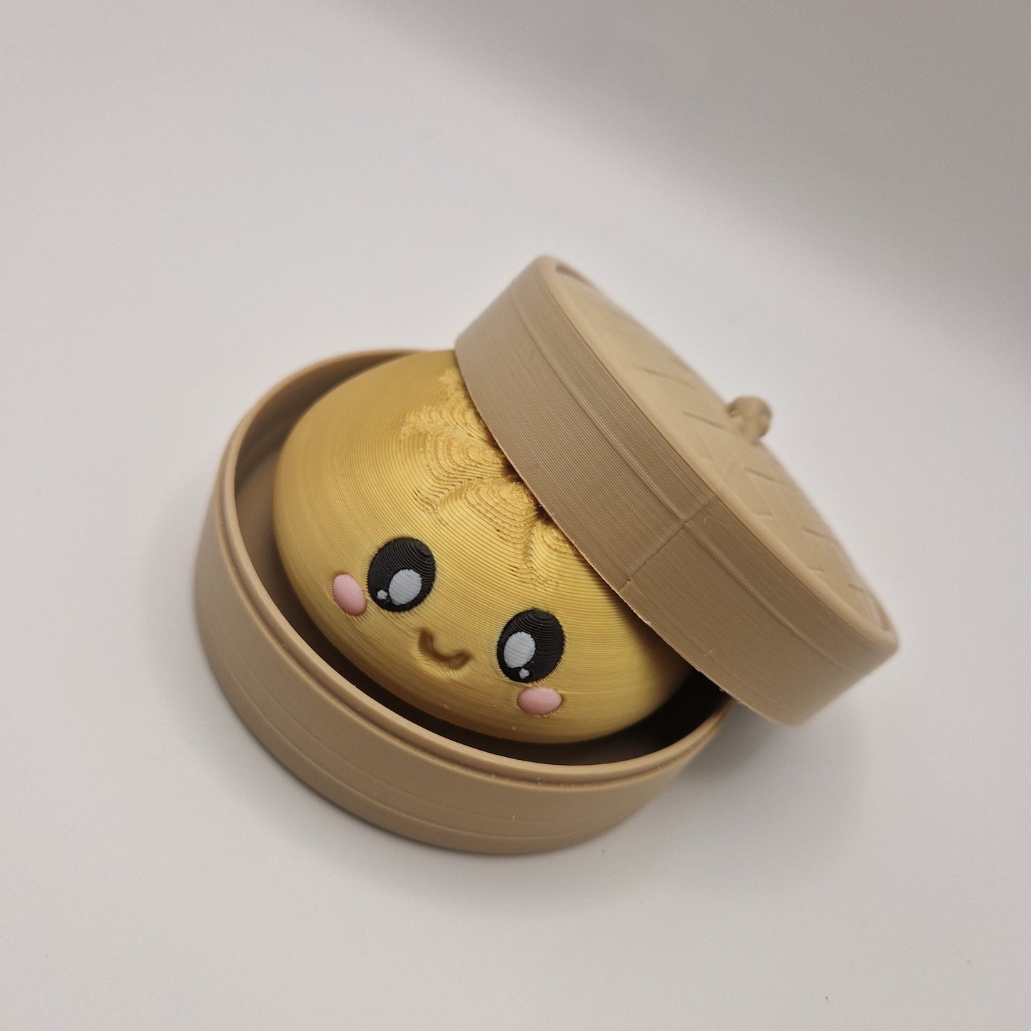 3d printed Dumpling clickers in steamer basket